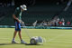 Day 9 Wed 29 Jun 2011 - A groundsman marks out the white lines on Centre Court